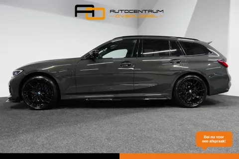 BMW 3-serie Touring 330e xDrive M Sport / M340i Diffuser /  Black Diamond M grille / M340i M Sport bumper pakket / BMW Laser Light / Panoramadak / Premium kleur Dravitgrau / Elektr. verstelbare voorstoelen links met memory / Apple Carplay - Android Auto / Stoelverwarming / HUD / 19'' LMV / Trekhaak (afneembaar) / Lederen bekleding / Adaptief M onderstel