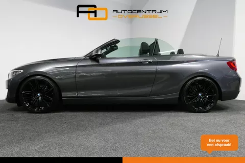 BMW 2-serie Cabrio 218i Essential / Stoelverwarming / Windscherm / Climatronic / 19'' LMV / Parkeersensoren achter / BMW Radio Professional / Licht- &amp; regensensor / Multimedia systeem
