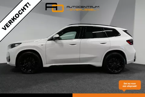 VERKOCHT BMW X1 sDrive18i M-Sport BMW X1 sDrive18i M-Sport / Shadow Line / Panoramadak / 20"LMV / Lederen bekleding / Elek. Stoelverstelling / Adaptive Cruise Control / Trekhaak (wegklapbaar) / Stoelverwarming / Navigatie / Keyless / Harman Kardon / Apple Carplay-Android Auto / Lane Assist / Side Assist / Verlengde dealer garantie t/m 27-03-2026